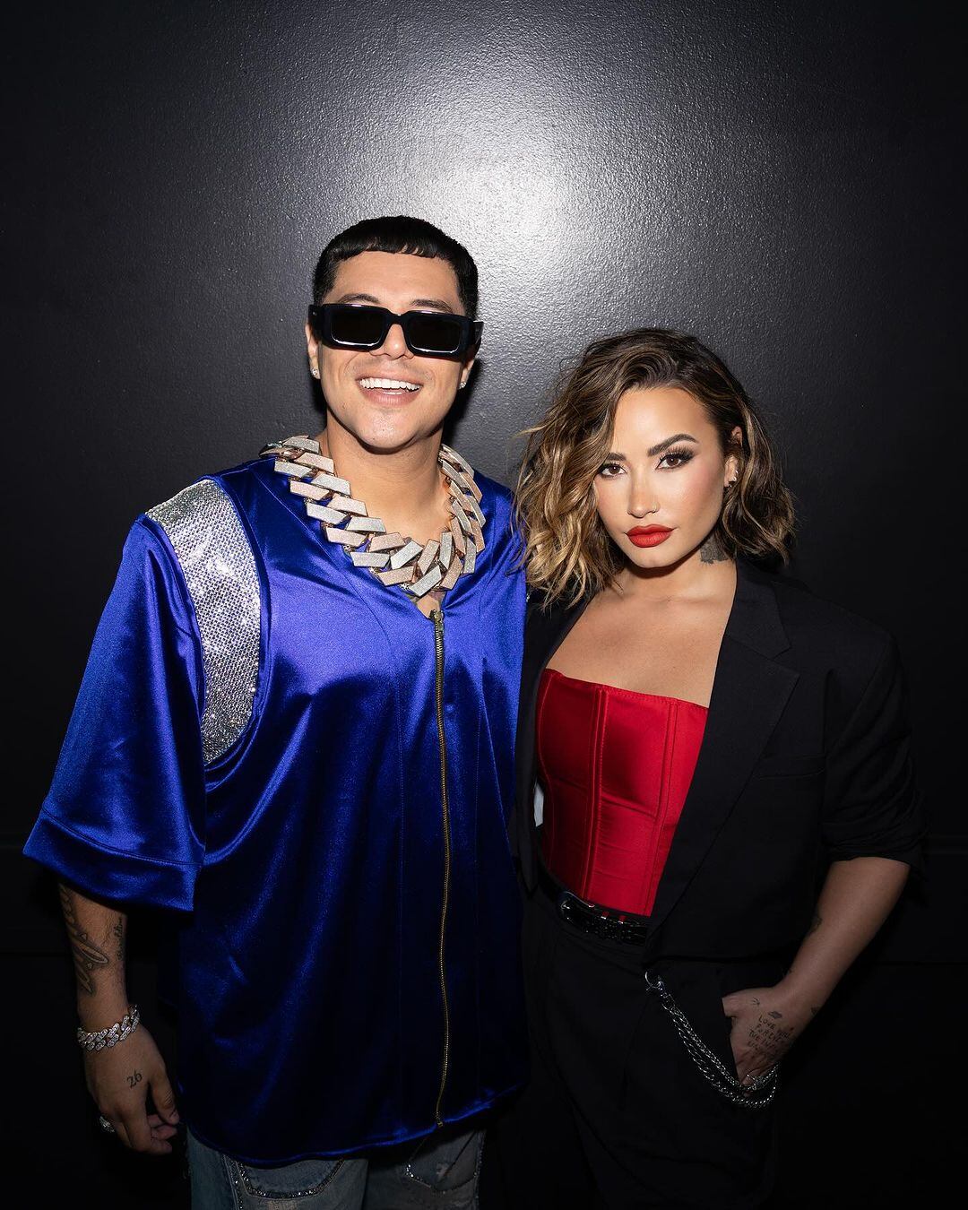 Grupo Firme y Demi Lovato