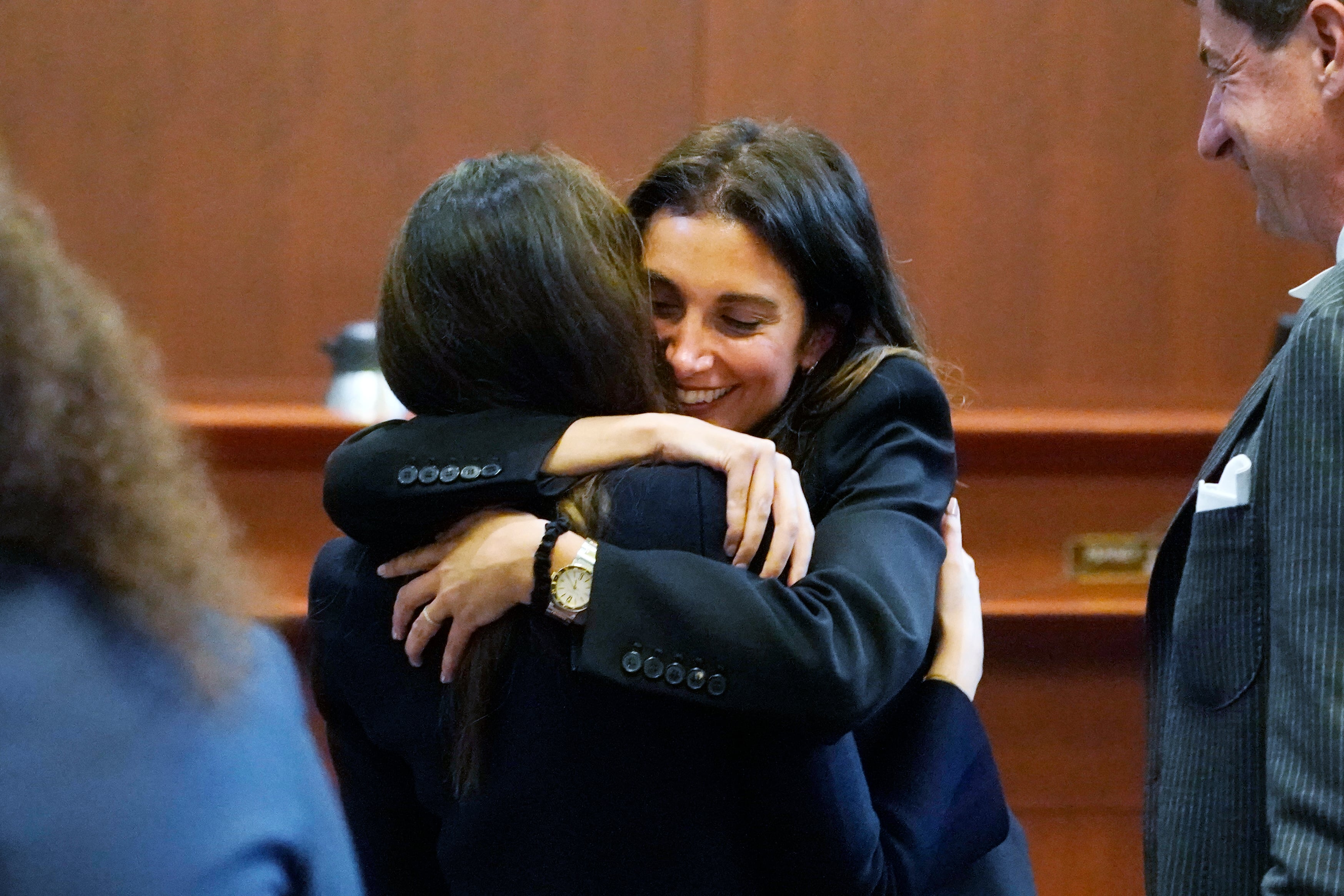 Attorney Joelle Rich hugs attorney Camille Vasquez (AP Photo/Steve Helber, Pool)