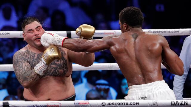 Defending champion Andy Ruiz Jr., left, takes a jab to the face during his fight against Britain's Anthony Joshua in their World Heavyweight Championship contest at the Diriyah Arena, Riyadh, Saudi Arabia. (AP Photo/Hassan Ammar)