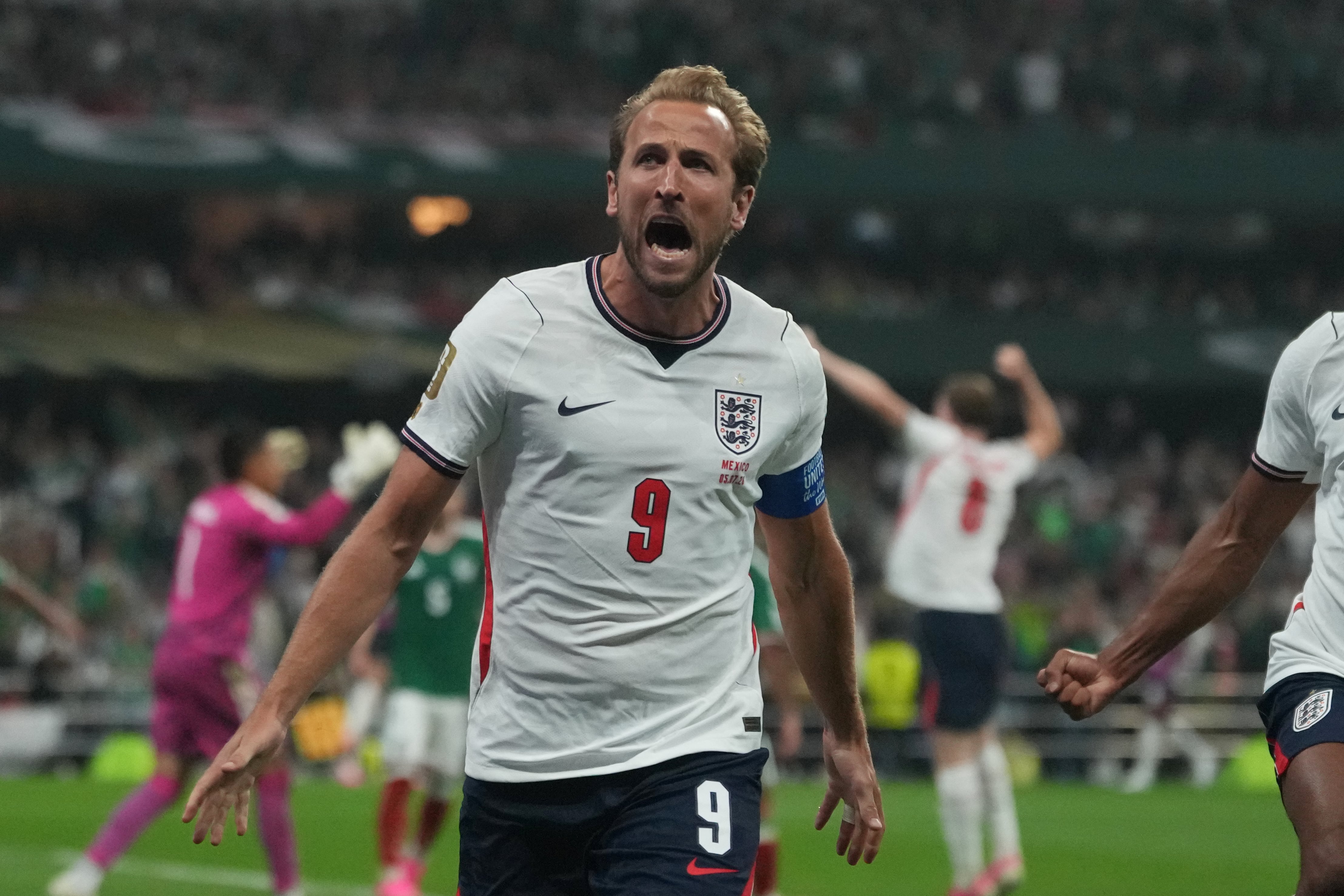 England's Harry Kane (9) celebrates after scoring his side's third goal through penalty kick during the World Cup round of 16 soccer match between Mexico and England in Mexico City, Sunday, July 5, 2026. (AP Photo/Eduardo Verdugo)