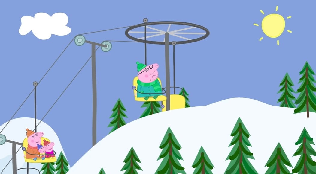 La familia de Peppa Pig en la montaña nevada
