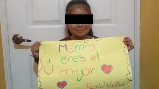 Lupita portando su cartel.