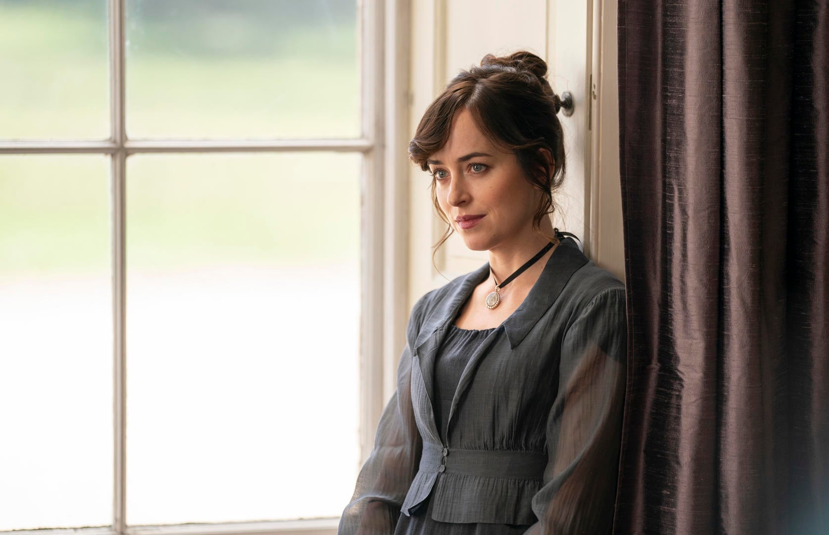 DAKOTA JOHNSON as ANNE ELLIOT in PERSUASION.