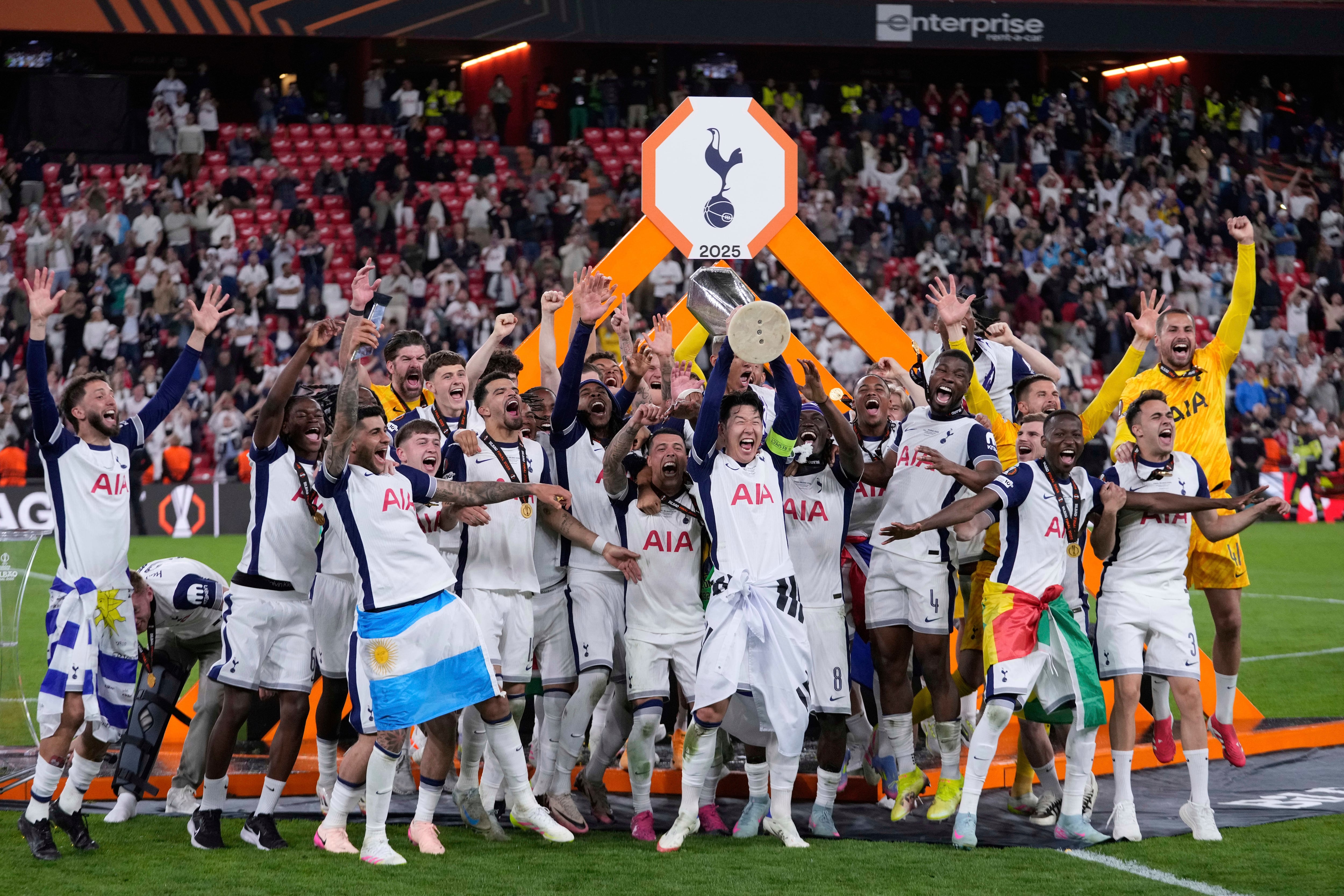 Tottenham's Son Heung-min holds up the trophy after winning the Europa League final soccer match between Tottenham Hotspur and Manchester United at the San Mames Stadium in Bilbao, Spain, Wednesday, May 21, 2025. (AP Photo/Bernat Armangue)
