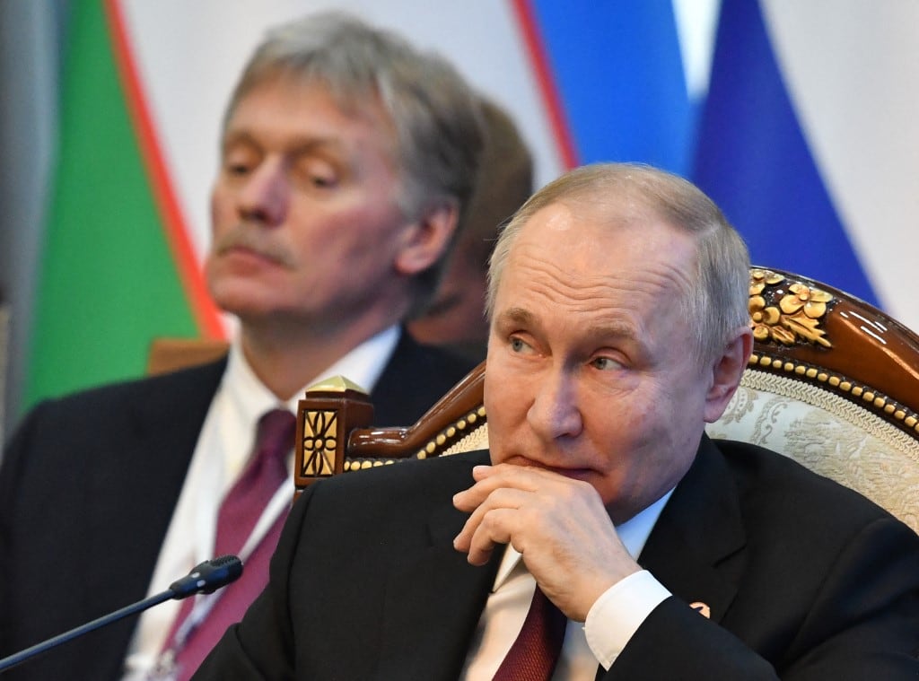 Vladimir Putin y Dmitri Peskov, porta voz de Rusia