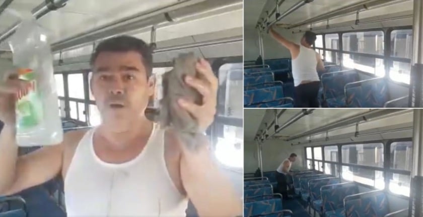 Chofer limpia su camión.