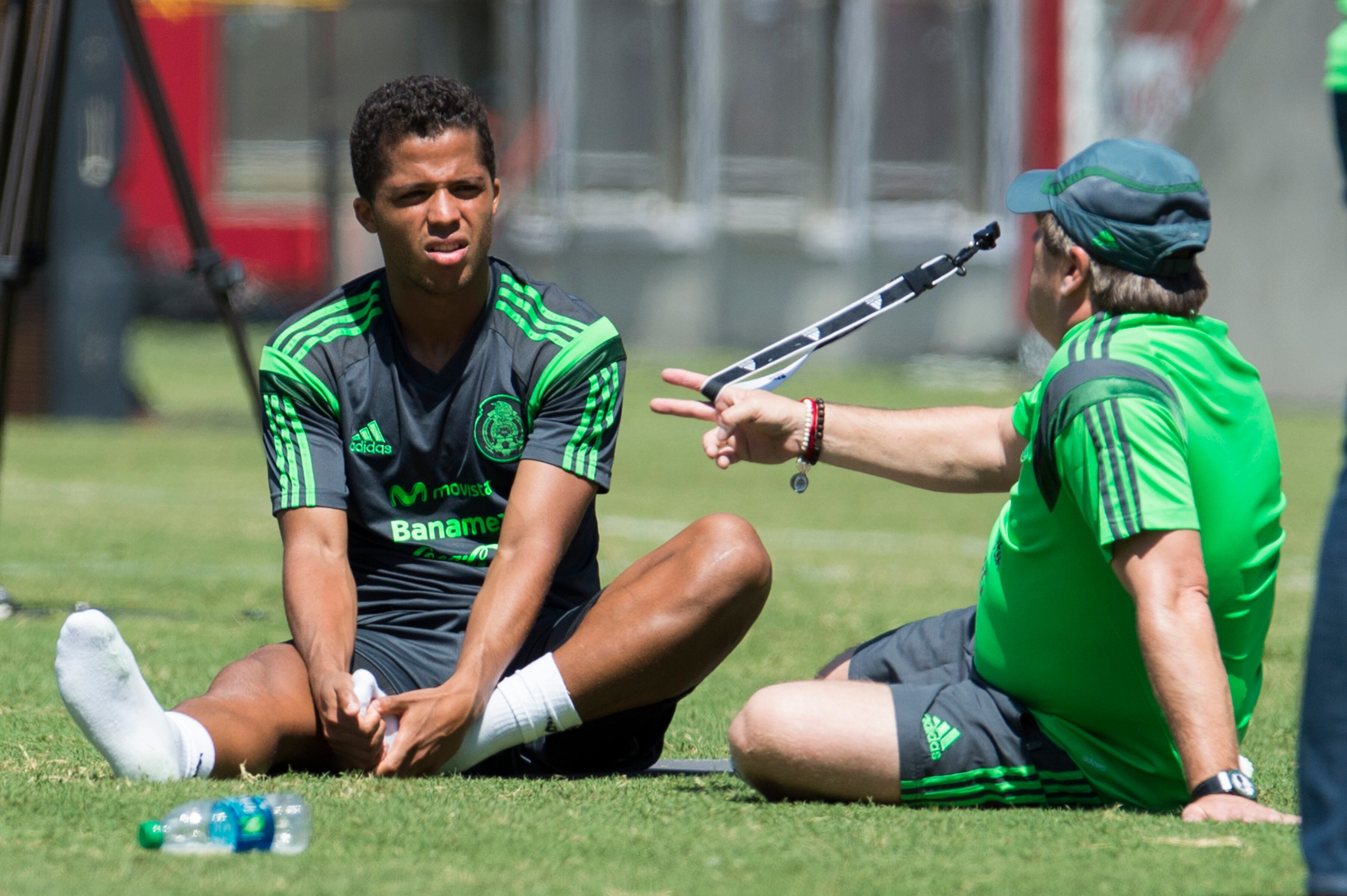 Giovani y Miguel Herrera