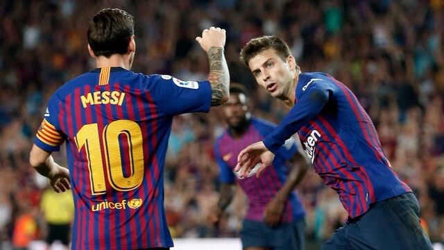 Messi y Pique celebran un gol.