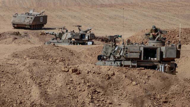 Israeli forces gathered along the border with Gaza