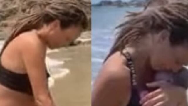 Madre dando a luz en la playa