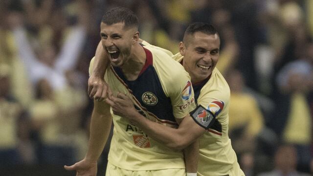 Aguilar y Rodríguez en un partido con América