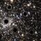 Telescopio Hubble descubre concentración de mini agujeros negros