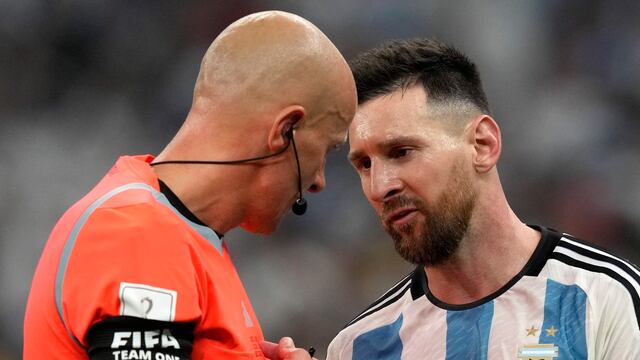 Szymon Marciniak y Lionel Messi