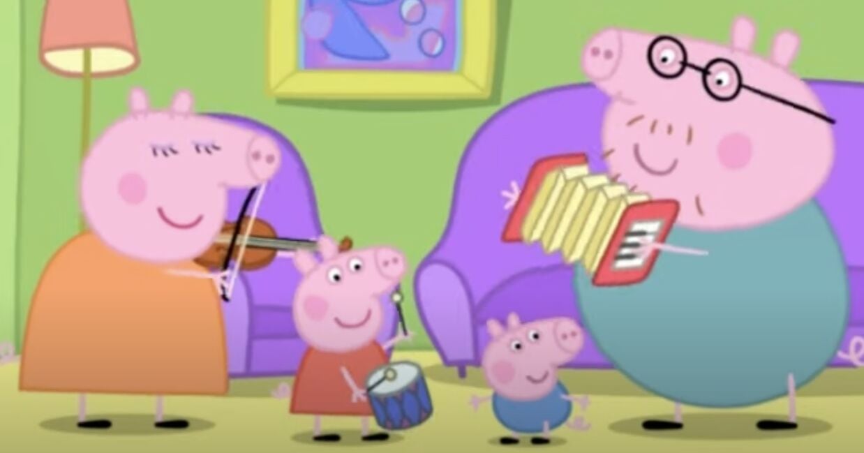 Papá Cerdito toca el acordeón para Peppa Pig