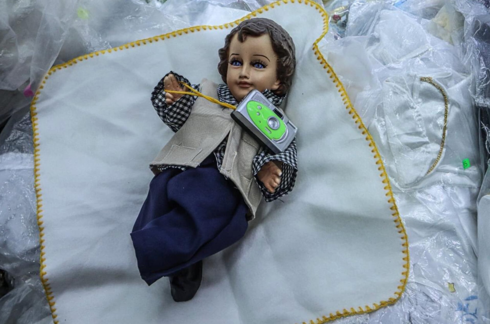 Niño dios fotógrafo