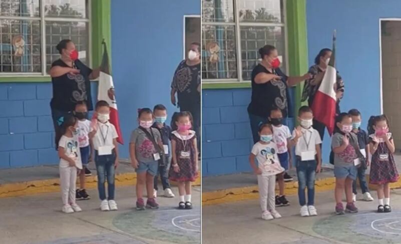 Niños saludan en honores a la bandera