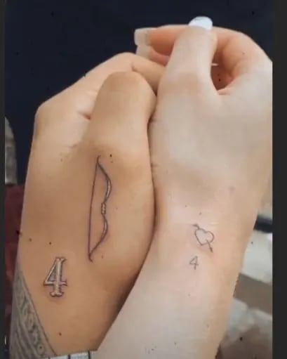 Los 4 tatuajes de Christian Nodal sobre Belinda